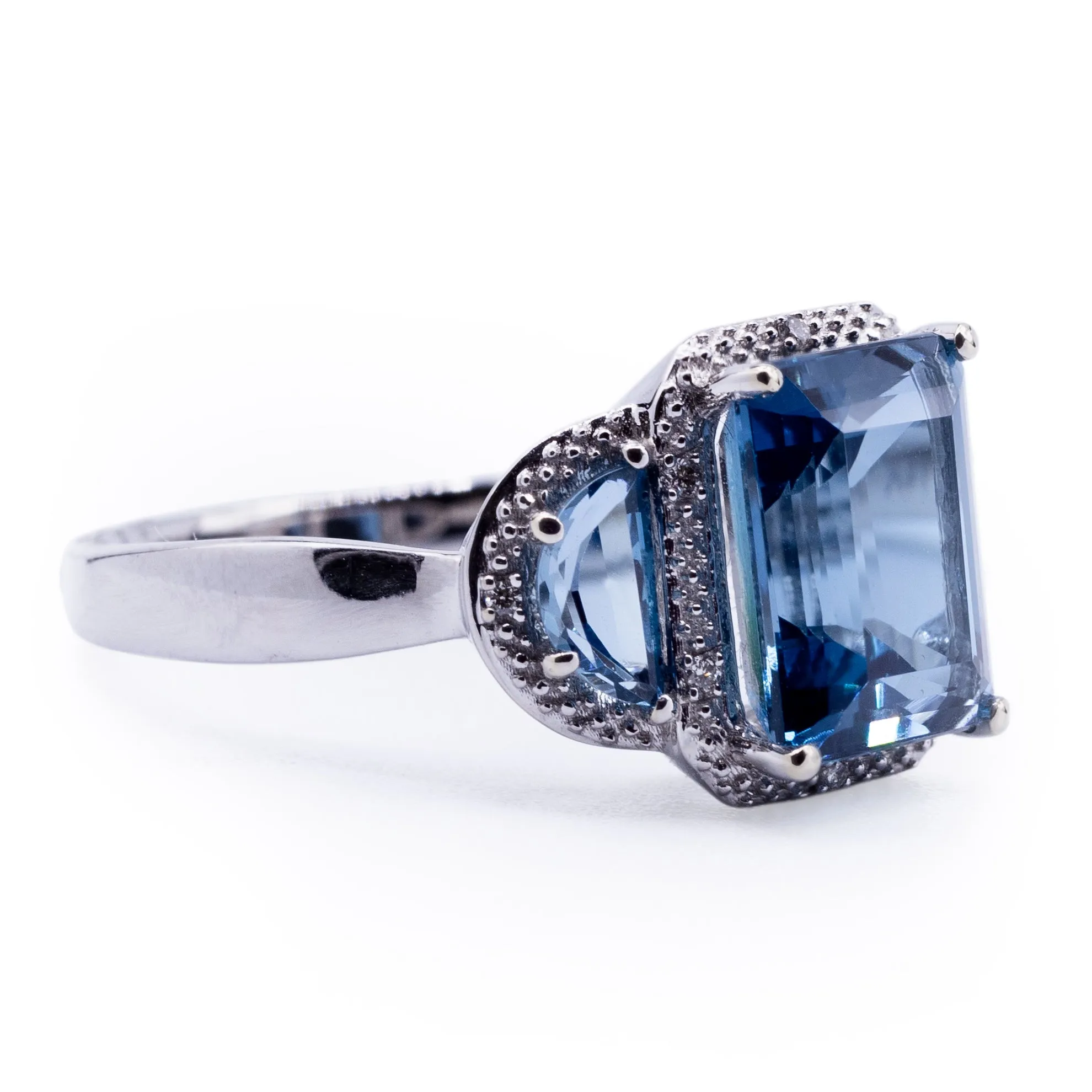 Three London Blue Topaz Stone Ring with Half Moon Side Stones and Diamond Accented Halo